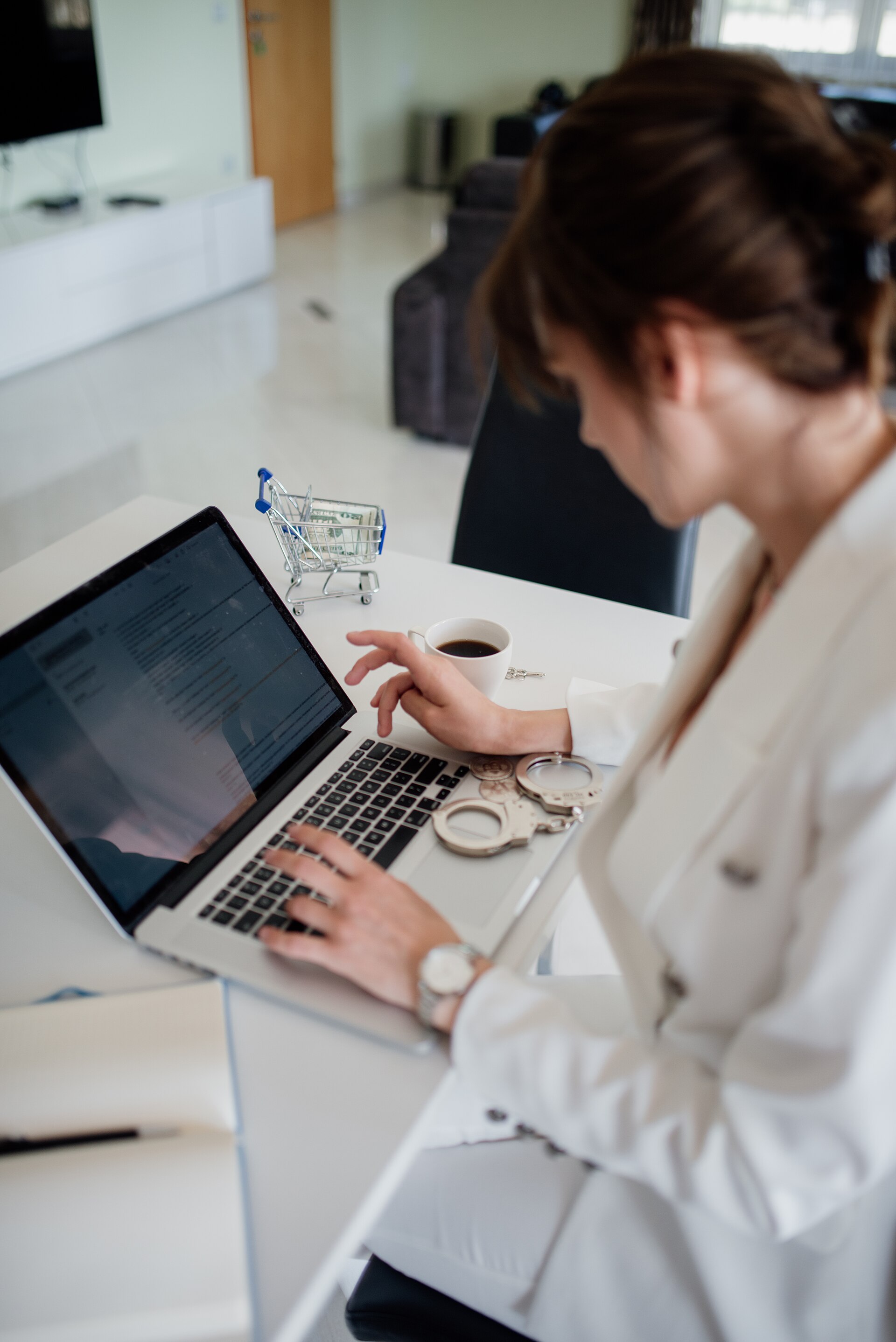 Person reviewing secure documents on a laptop at a desk